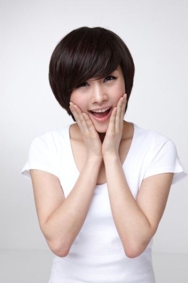Korean Short Hairstyle : Smiling Young Cute Asian Woman With Korean Short Hairstyle In Stock Photo Picture And Royalty Free Image Image 128754901 / Korean hairstyles tomboy haircut asian haircut short korean bangs.